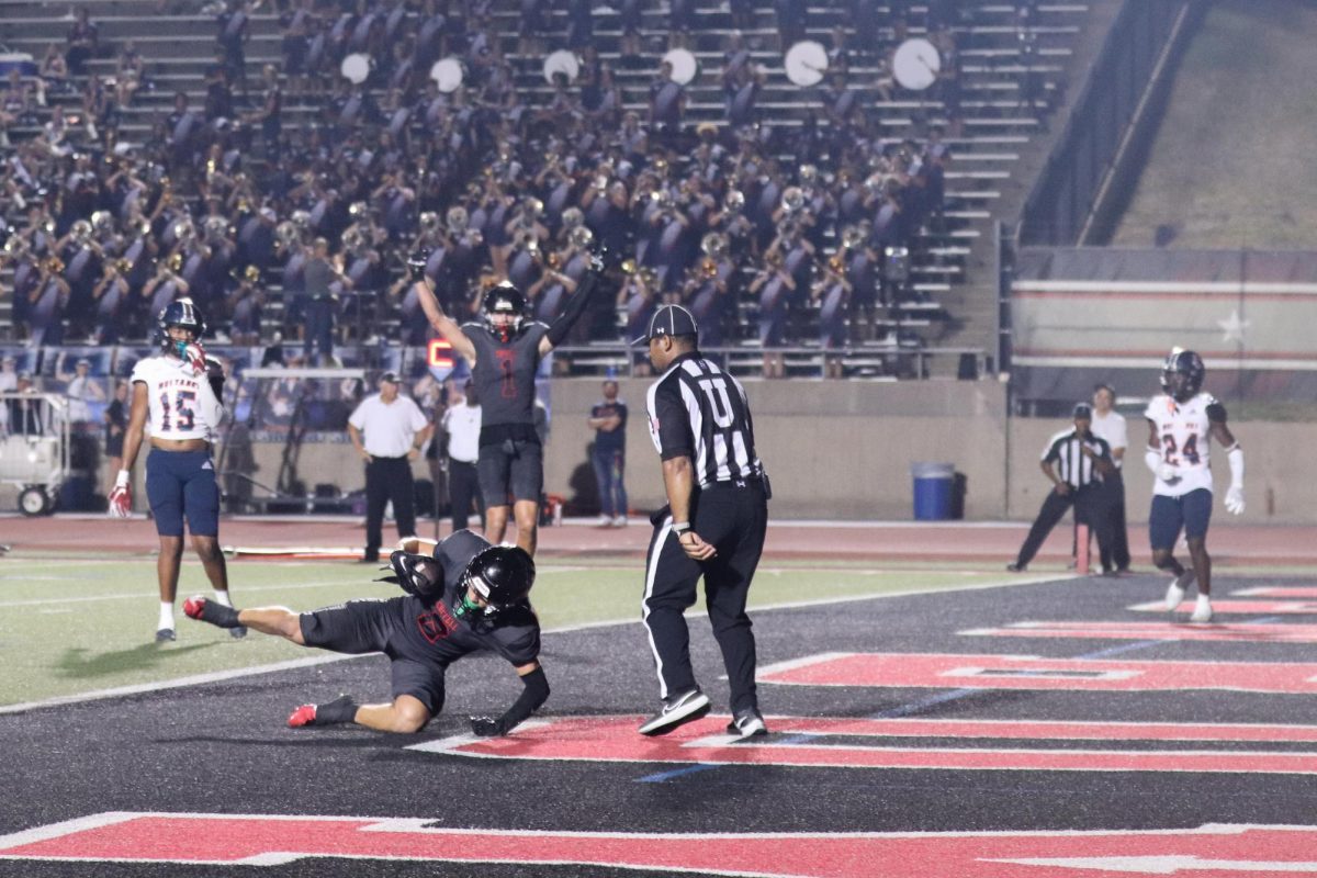 Coppell senior wide receiver Luca Gtosoli secures a touchdown against Sachse during the fourth quarter to bring the score to 41-34, with Coppell leading at Buddy Echols Field on Friday. Coppell defeated Sachse 44-41, in the season opener.