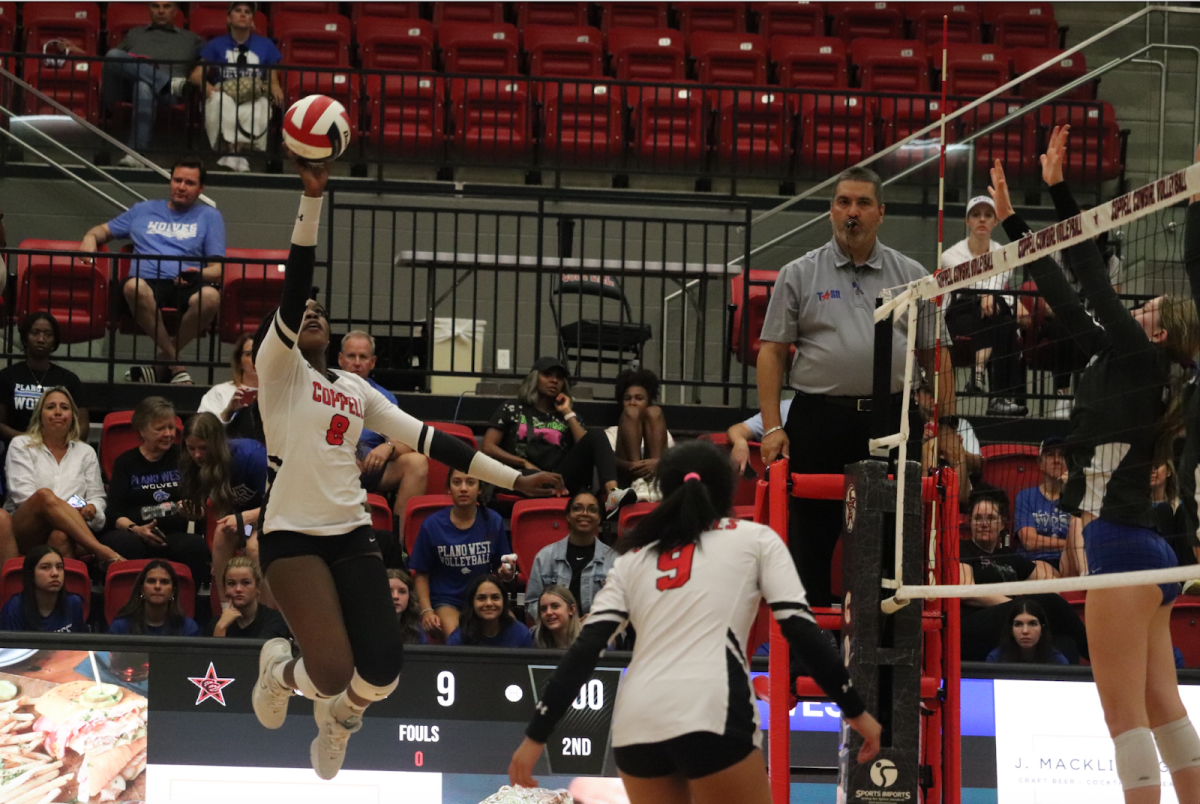 Coppell senior outside hitter Daki Kahungu tips over the net against Plano West at CHS Arena on Friday. The Lady Wolves defeated the Cowgirls 25-8, 25-17, 25-23.