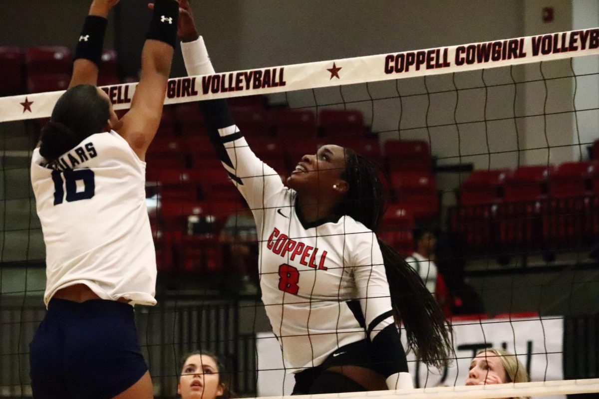 Coppell senior outside hitter Daki Kahungu blocks a spike against Flower Mound on Sept. 26 at CHS Arena. The Cowgirls play Plano East tomorrow at 6:30 p.m.