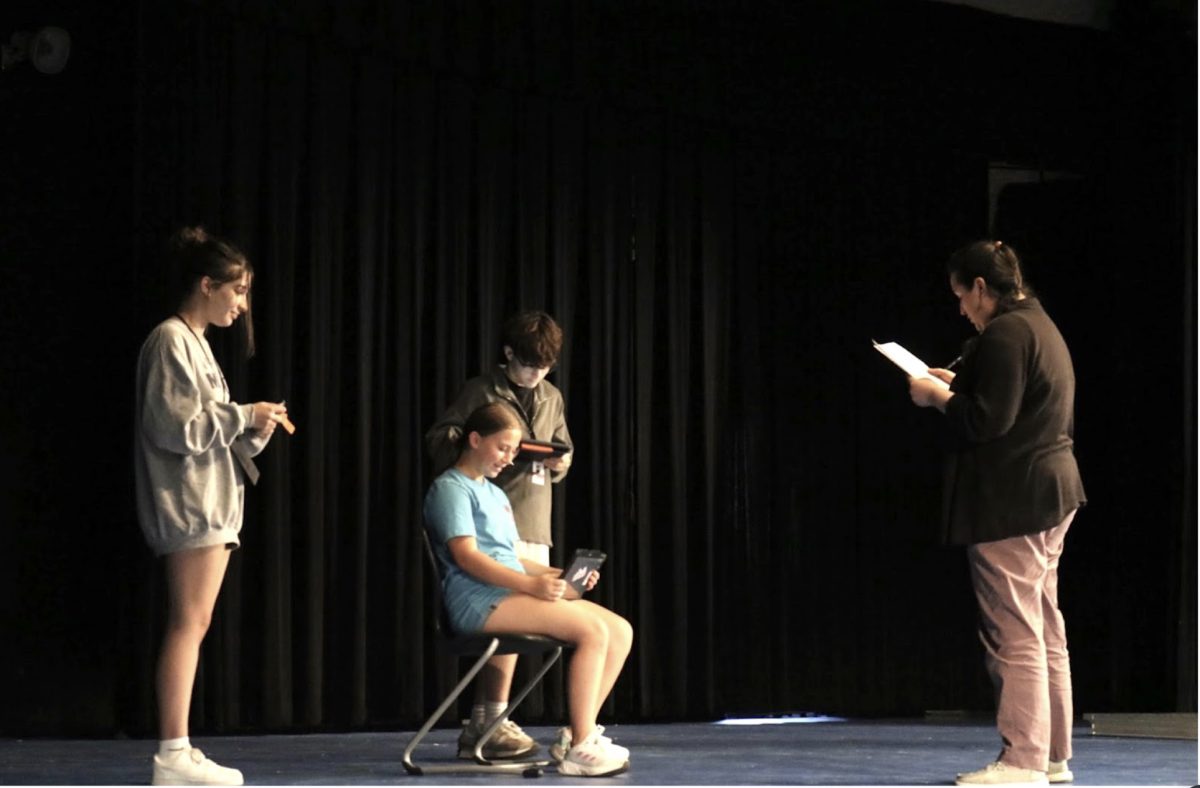 CHS9 head theater director Eugenia Montoya, gives stage directions to freshmen Samantha Gellman, Lena Gay and Teo Petrov in the CHS9 Dome on Monday. The CHS9 Theatre Company is performing “Too Much Light Makes The Baby Go Blind” from Oct. 26-28.