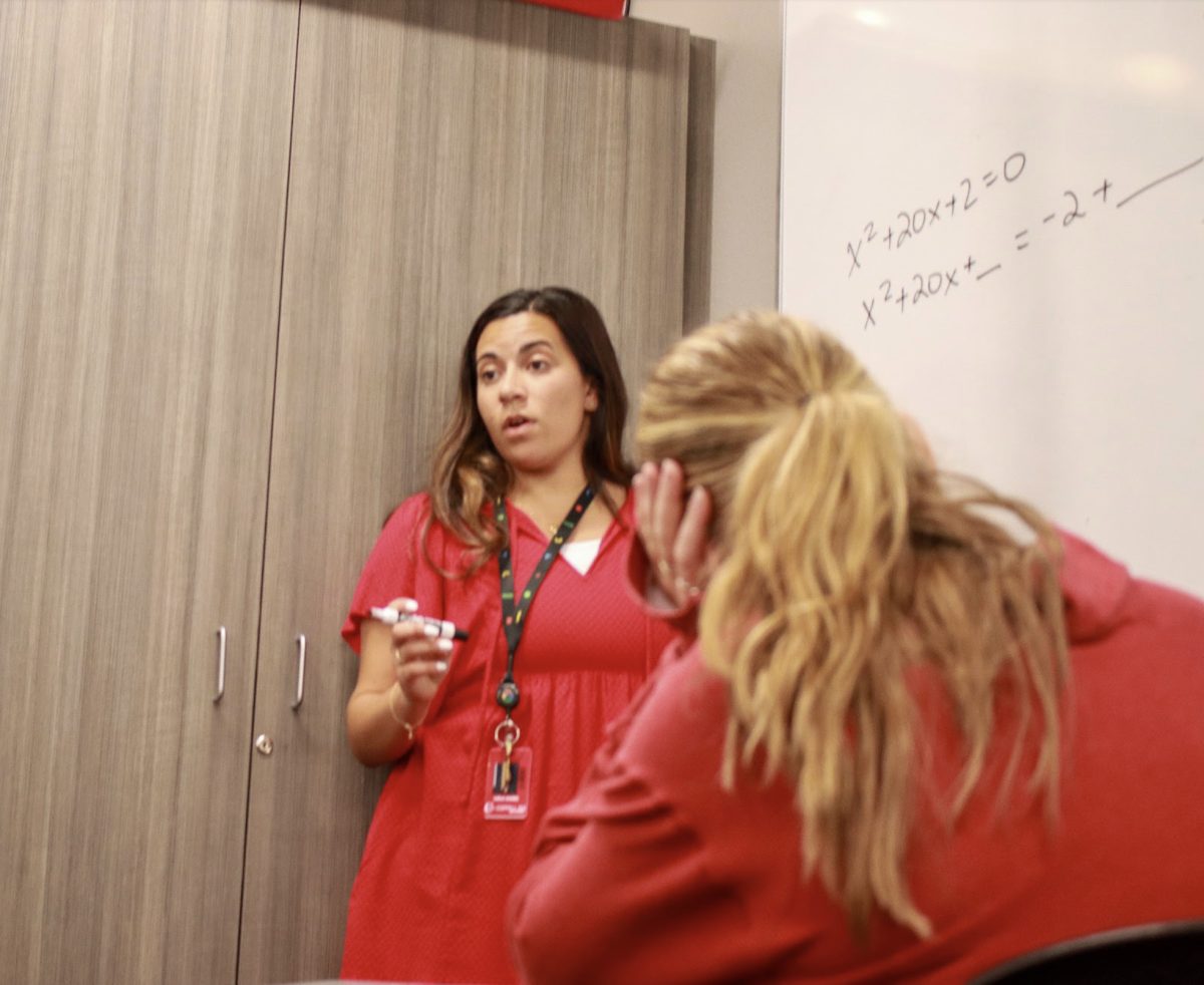 Coppell High School algebra II and pre-calculus teacher Laila Kamel teaches students to complete the square in her algebra II class. Kamel was previously a CHS alum and worked at Google and IBM before coming back to Coppell. Anushree De