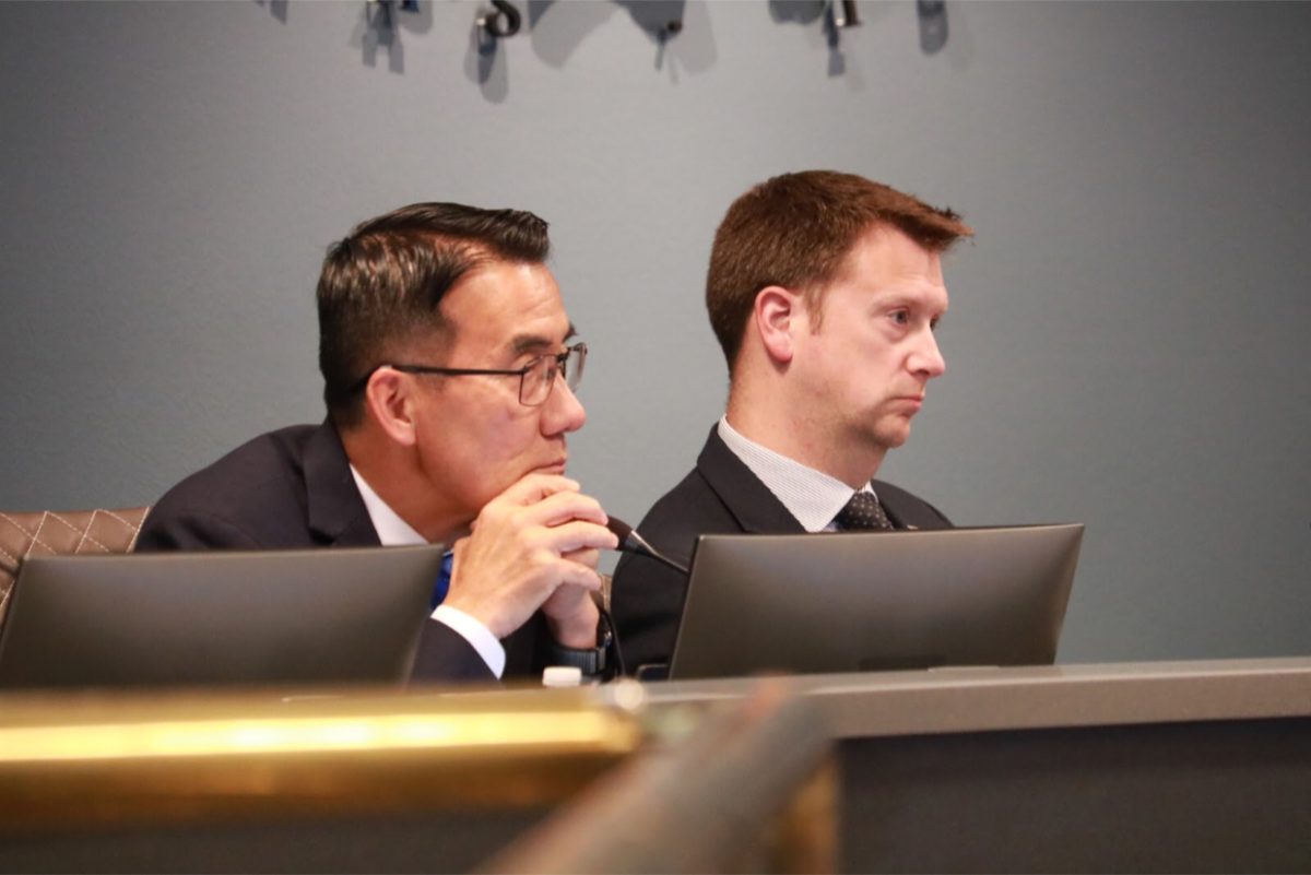 Coppell Mayor Pro Tem John Jun and council member Kevin Nevels listen to a zoning request made by resident Kristina Lowe to remove the five cypress trees in her backyard. Coppell City Council held its regular session on Tuesday in the council chamber at Town Center.