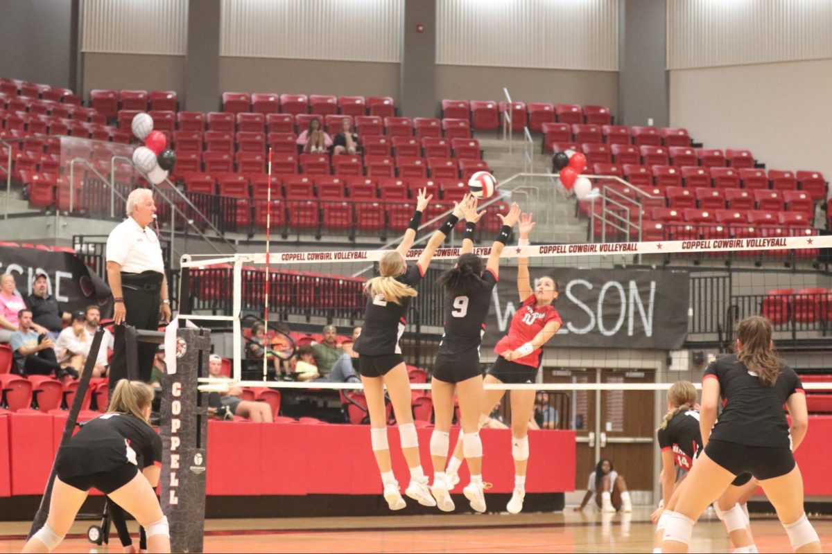 Coppell senior outside hitters Mira Klem and Alena Truong block against Flower Mound Marcus at CHS Arena on Sept. 15. The Coppell volleyball team plays Flower Mound tomorrow at 6:30 p.m. 