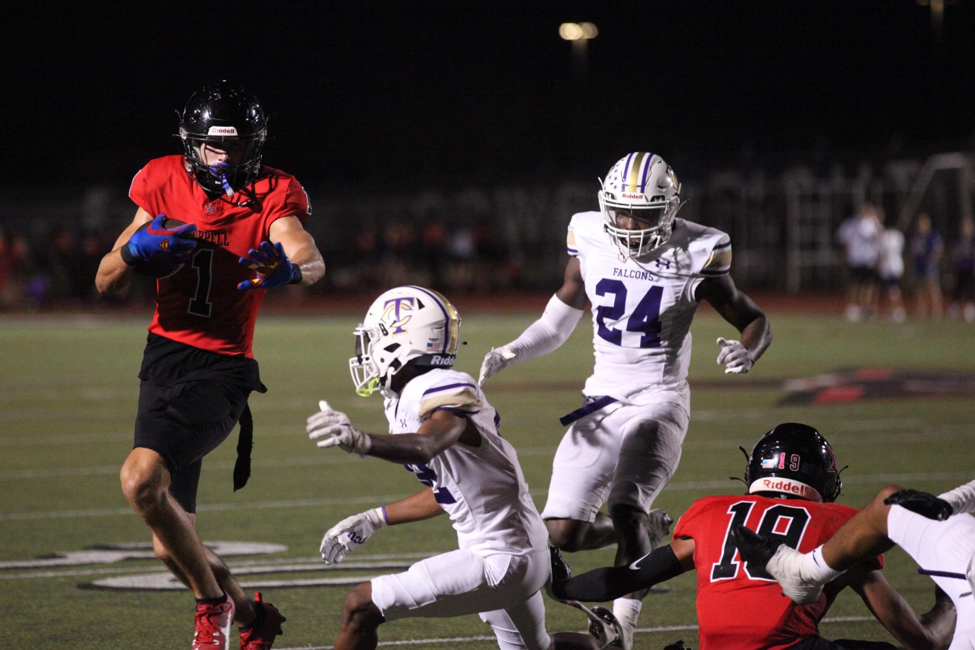 Coppell senior wide receiver Baron Tipton evades Keller Timber Creek defense at Buddy Echols Field on Friday. Friday night’s game against the Timber Creek falcons came to an abrupt end at halftime due to continuous lightning delays throughout the night; the game ended with Coppell up, 21-14