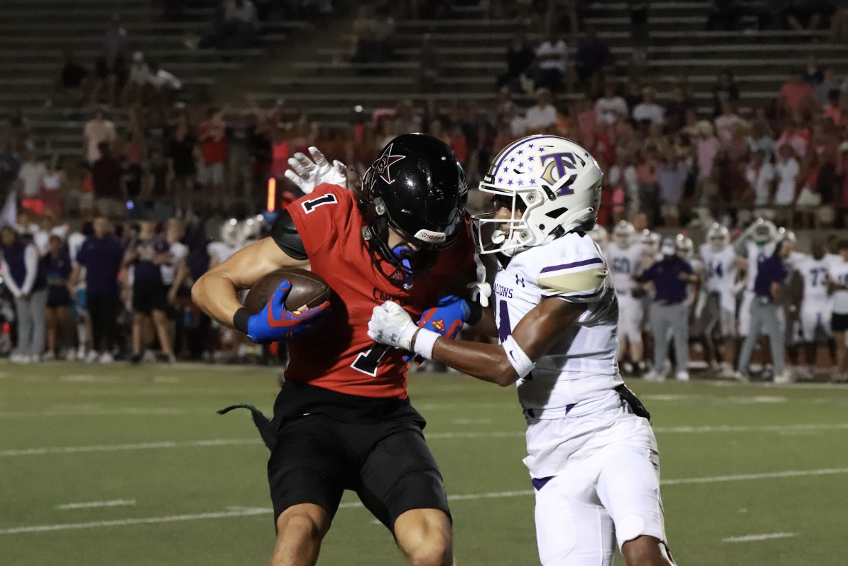 Coppell senior wide receiver Baron Tipton rushes past Keller Timber Creek junior wide receiver Antwan Bridges on Sept. 8 at Buddy Echols Field. The Cowboys face Plano West tomorrow at 7 p.m. at John Clark Stadium in their first District 6-6A game of the season. Ava Johnson