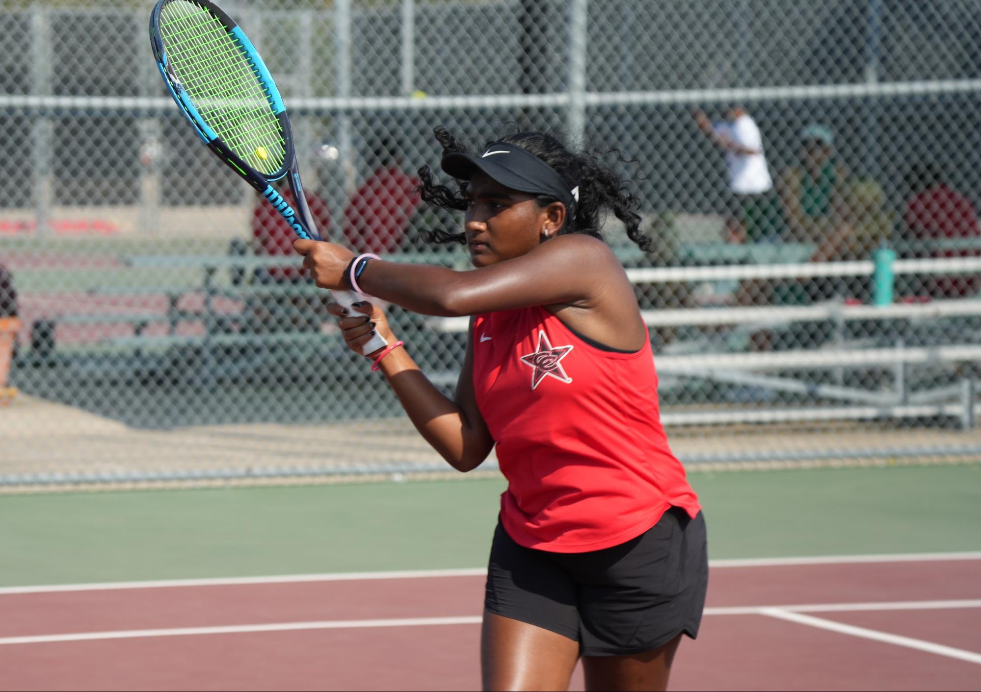 Coppell junior Sarayu Thallapareddy hits a forehand during practice last Friday. Coppell tennis team made a comeback when playing against Flower Mound on Tuesday.