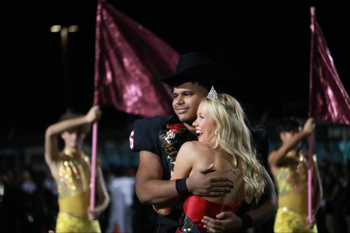 Coppell seniors Alex Jackson and Tali Colclasure are announced as homecoming king and queen during halftime at Buddy Echols Field on Oct. 13. Coppell defeated Plano East, 35-7, in the homecoming game.