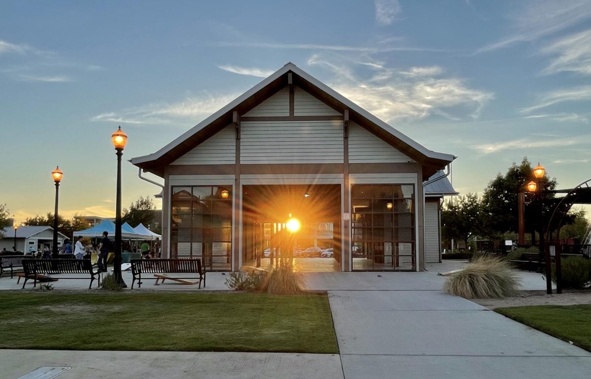 Sun hits the entrance of the pavilion at Old Town Coppell, marking the beginning of the Sunset Social on Sept. 30. The Sunset Social allowed Coppell residents to come out and enjoy a night of fun filled with music, food and lawn games.
