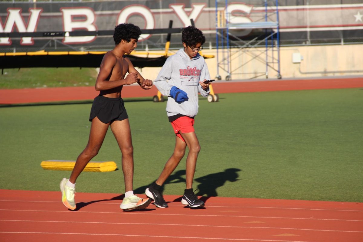 Coppell sophomore Ansh Singhal and junior Pranav Vegiraju run during cross country morning practice at Buddy Echols Field, preparing for the upcoming regional meet in Lubbock. The CHS cross country team competed at the District 6-6A meet on Friday with the boys placing first.