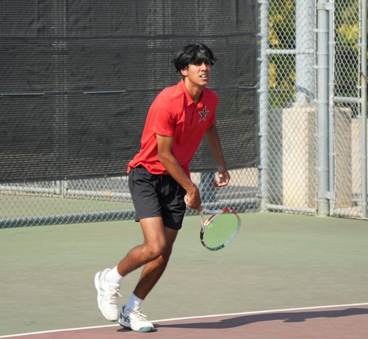 Coppell junior Shay Patel serves during afternoon tennis practice on Sep. 22. The Coppell tennis team defeated Dallas Ursuline and Jesuit, 22-5, on Sep. 29 at Coppell Tennis Center. 