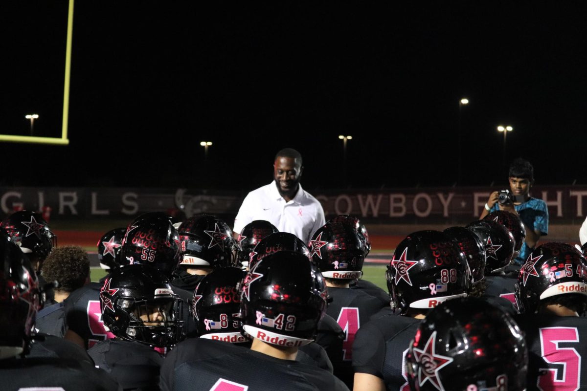 Coppell coach Antonio Wiley addresses his team after its 51-21 victory against Flower Mound at Buddy Echols Field on Friday. The Cowboys remain unbeaten in District 6-6A and 9-0 overall in the season.