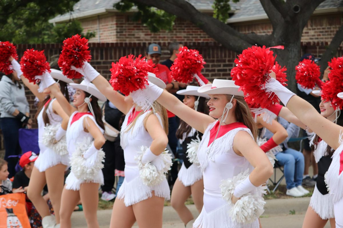 Coppell High School Larriettes march down West Parkway Boulevard in the 2023 Homecoming Parade on Oct. 11. The annual Homecoming Parade features different Coppell organizations walking to cheer on Coppell’s football team in its Homecoming game on Friday. 