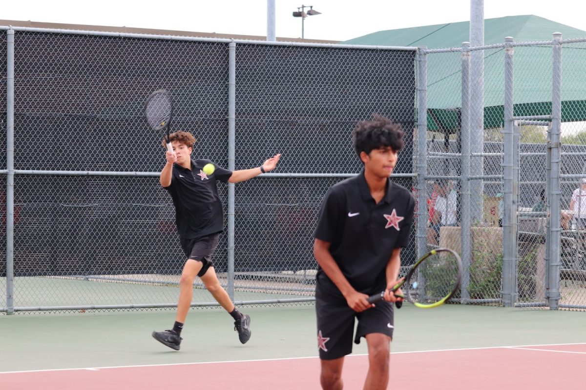 Coppell senior Juandiego Velazquez returns during his doubles match with junior Aneesh Thummala against McKinney Boyd on Tuesday at the Coppell Tennis Center. Coppell faces Flower Mound today in the Class 6A Region I quarterfinals at Flower Mound High School. 