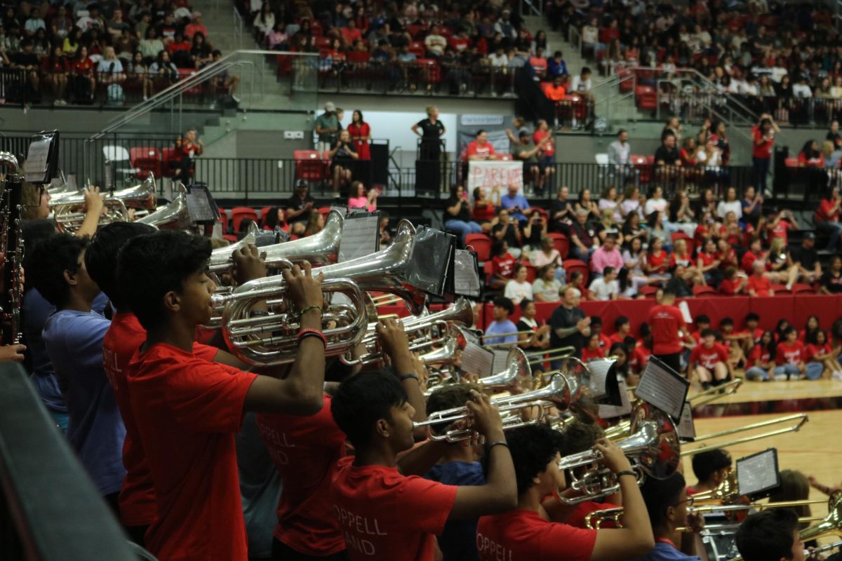 Coppell Band kicks off the pep rally by playing the school fight song on Sept. 29 at the Coppell High School arena. The red out pep rally during first period had students come out to cheer in support of the CHS varsity football team for their game against Lewisville.