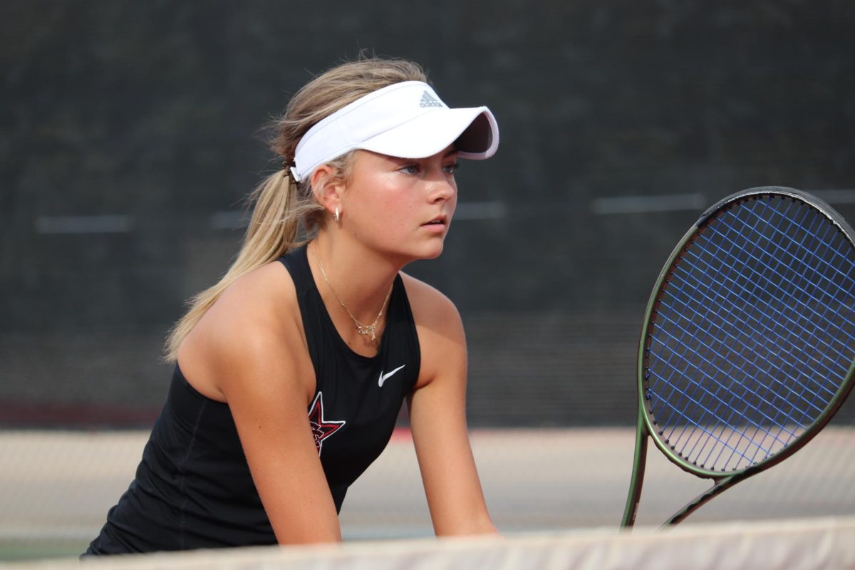 Coppell sophomore Lexie Patton prepares to return a serve during her doubles match against McKinney Boyd on Oct. 10 at the Coppell Tennis Center. Patton is captain of the tennis team and has been playing tennis for more than 10 years. Photo by Avani Munji