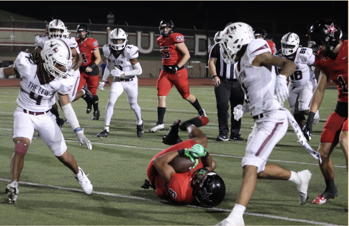 Cowboys running back Omarion Mbakwe makes a diving catch against Lewisville at Buddy Echols Field on Friday. Coppell won, 49-28, against the district champions.