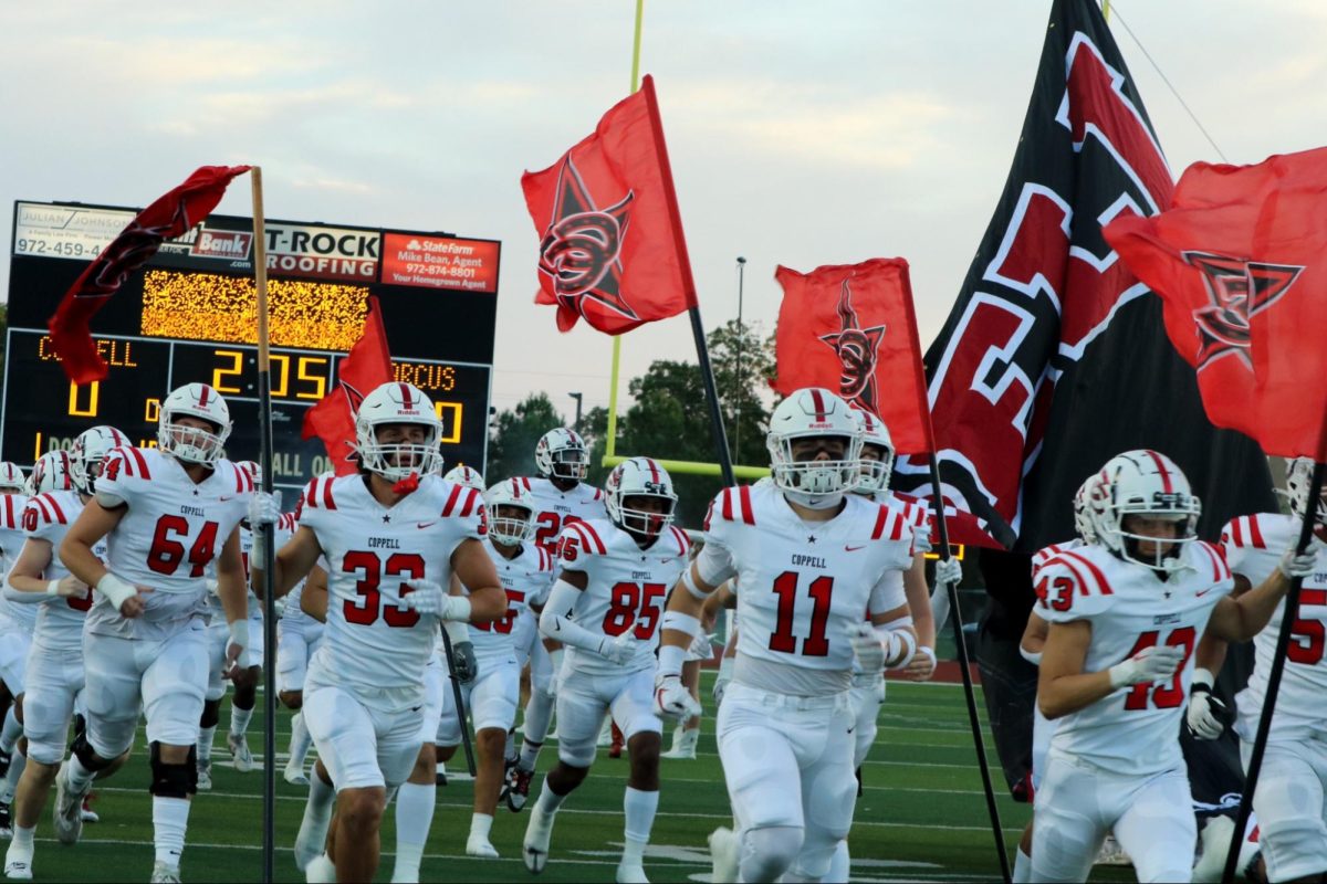 The Coppell football team takes the field on Friday at Marcus Marauder Stadium. Coppell defeated Flower Mound Marcus, 20-6.