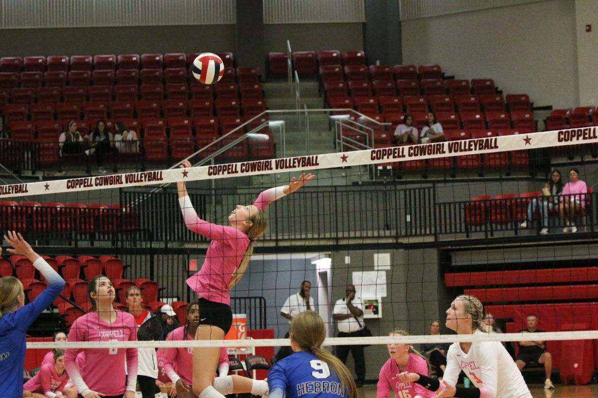 Coppell senior opposite hitter Mira Klem spikes the ball against Hebron at CHS Arena on Tuesday. The Cowgirls lost to Hebron, 3-2 (25-16, 25-10, 24-26, 11-25, 15-11), after a close back and forth match. 
