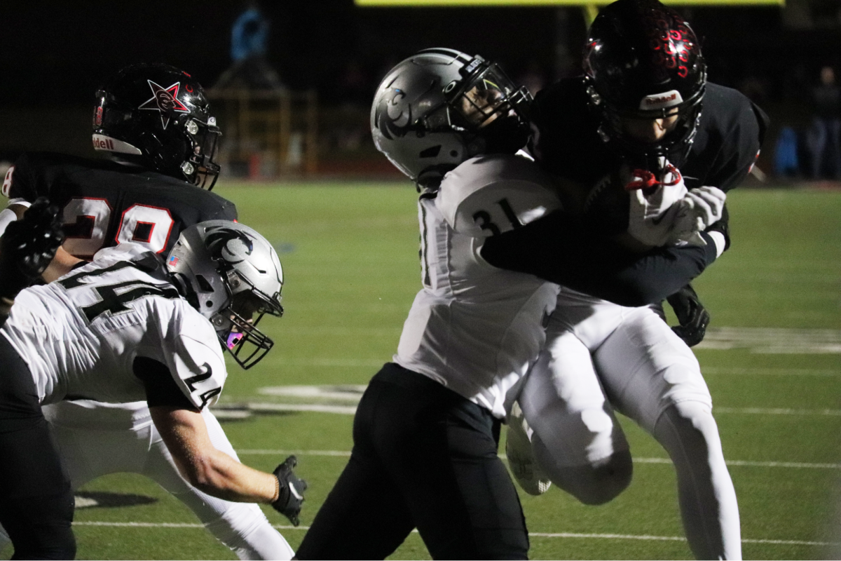 Coppell senior wide receiver Luca Grosoli rushes to the endzone, scoring Coppell’s first touchdown against Denton Guyer at Buddy Echols Field on Friday. The Cowboys defeated the Wildcats,35-21, advancing to the Class 6A Division II Region I area playoffs.