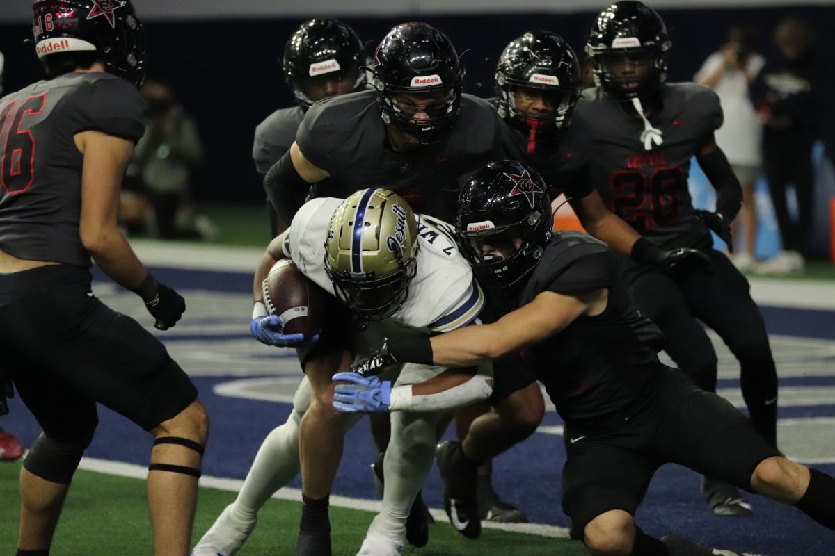 Coppell junior linebacker Weston Polk tackles Jesuit junior running back Zane Williams at Ford Center in Frisco. Coppell defeated Dallas Jesuit. 42-23, advancing to the Class 6A Division II Region I regionals.
