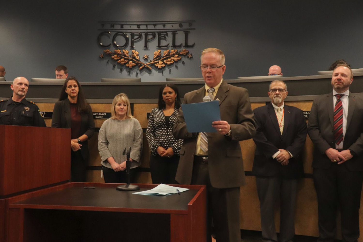 Coppell Mayor Wes Mays illustrates the Coppell Municipal Court’s role in preserving public safety at the Coppell City Council meeting. Coppell City Council met Tuesday at Town Center.
