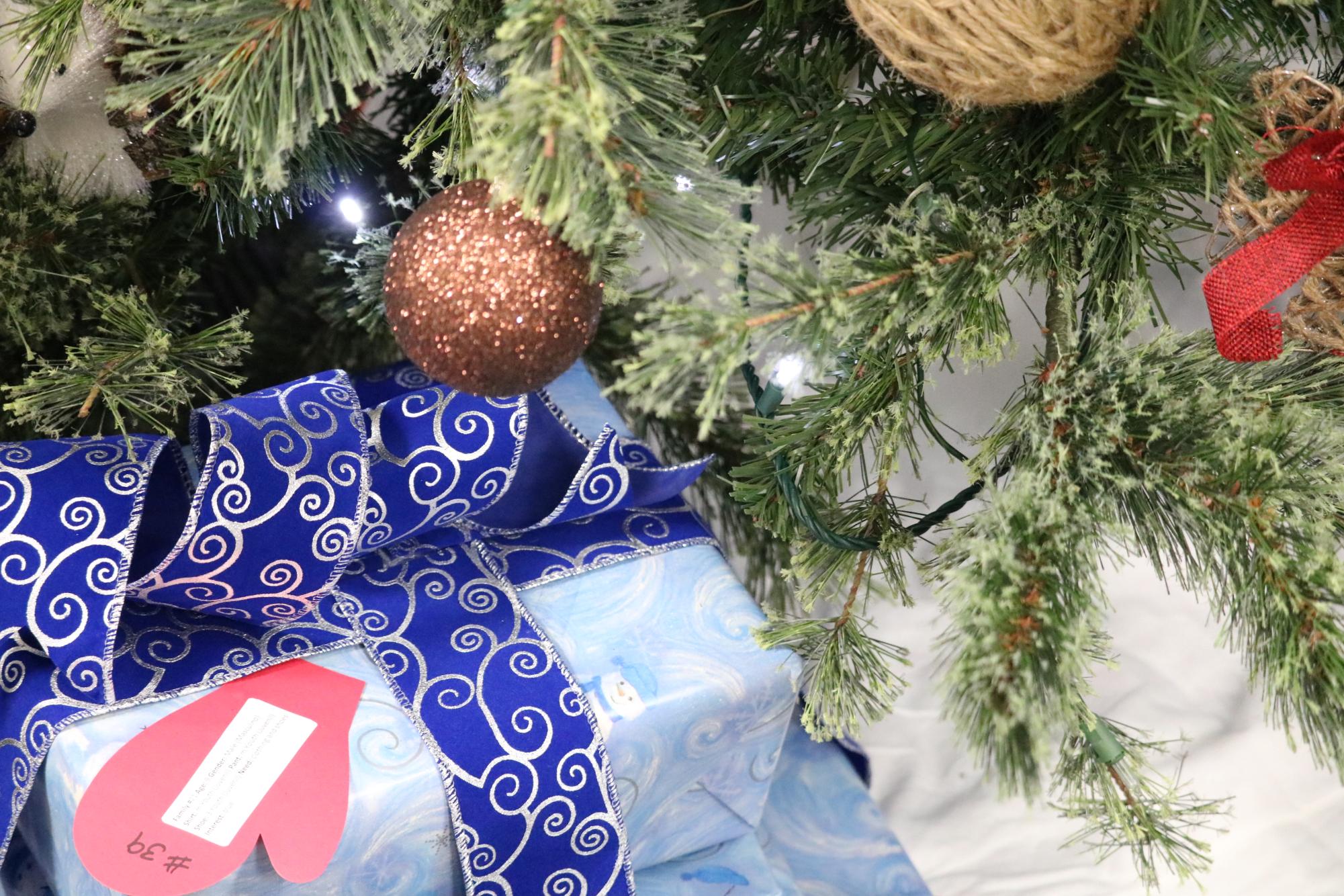 Donated presents sit under a Christmas tree in Coppell City Hall. Various locations around Coppell offer donation areas for Make A Child Smile, a Coppell-sponsored program that collects and delivers gifts to Coppell ISD students in need. Donations can be made through Friday.