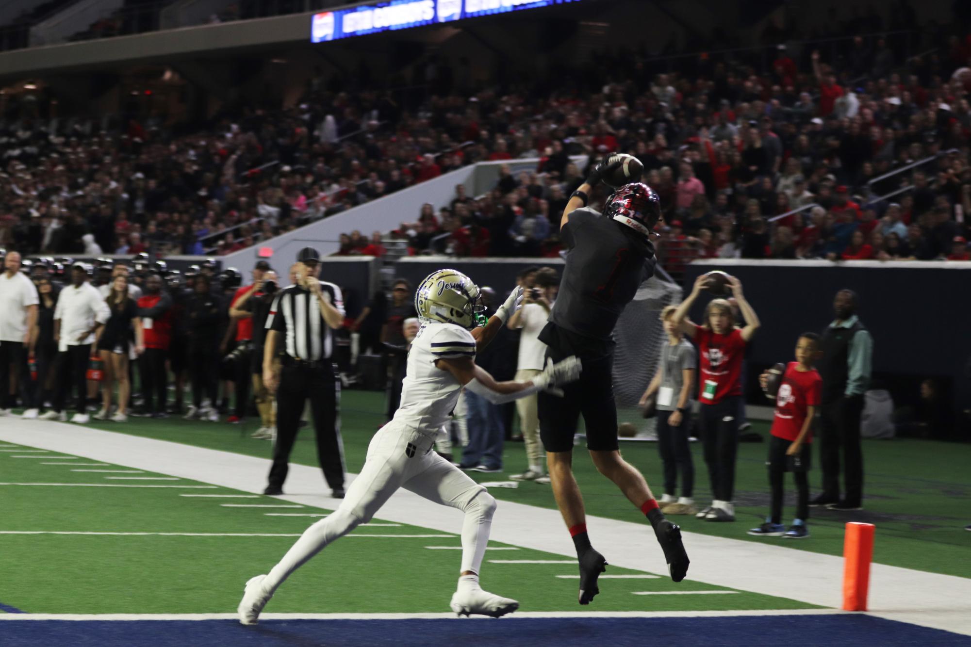 Senior wide receiver Baron Tipton brings in one of his three touchdown receptions on Thursday against Dallas Jesuit at Ford Center in Frisco. Coppell defeated Jesuit, 42-23, in the Division II Region I Area playoffs as a comeback effort in the third quarter fell short by Jesuit.