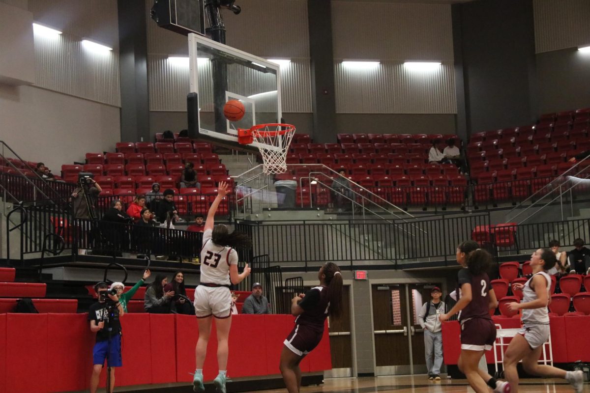 Coppell senior guard Ella Spiller scores against Lewisville on Tuesday at CHS Arena. Coppell defeated Lewisville, 76-51.