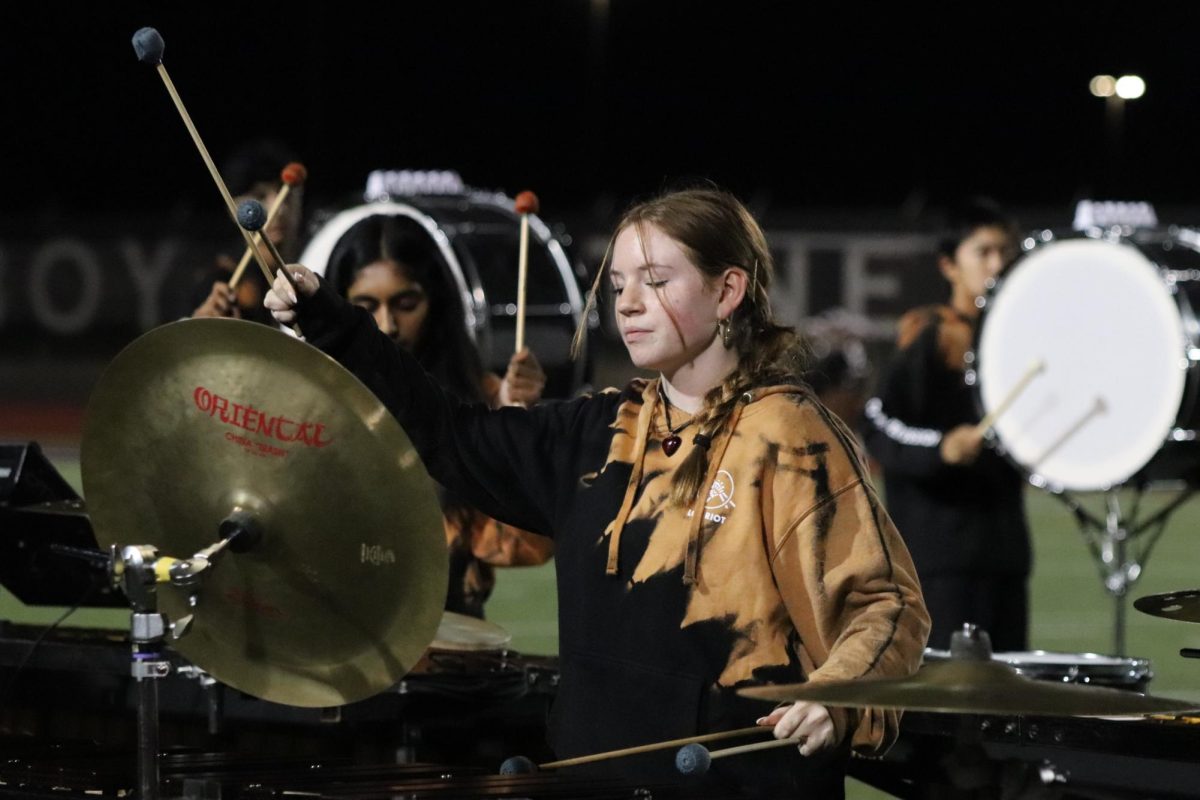 Coppell junior percussionist Sophie Depew performs “An Ancient Observer” at halftime on Nov. 10. Depew won the Percussive Arts Society Texas Chapter’s Day of Percussion high school individual competition in April for her marimba performance and plans to go into the music field after high school.