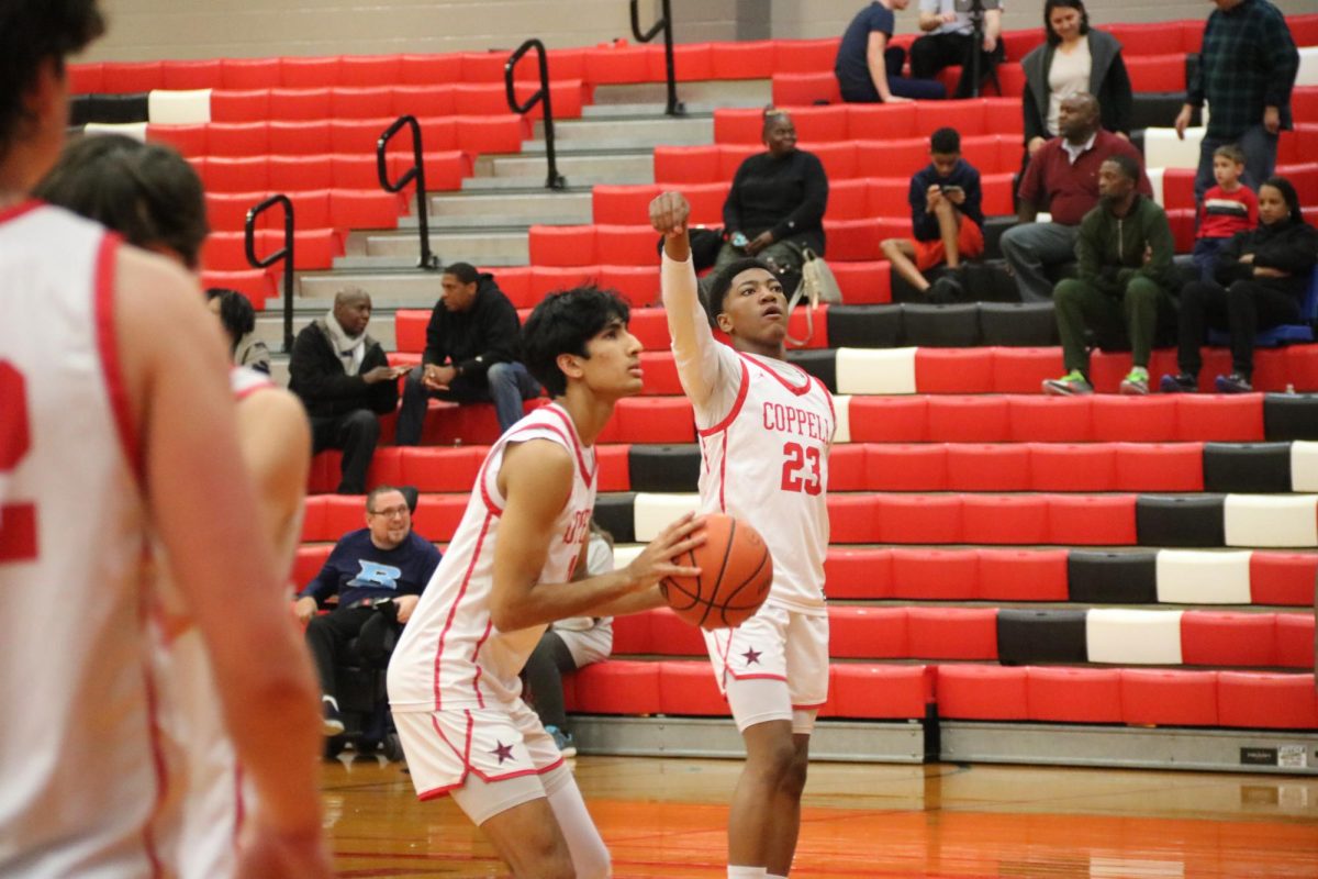 Coppell senior forward Arhan Lapsiwala shoots a free throw against Hurst L.D. Bell in the CHS Large Gym on Friday. Coppell defeated L.D. Bell, 62-51. Photo by Niharika Tallapaka