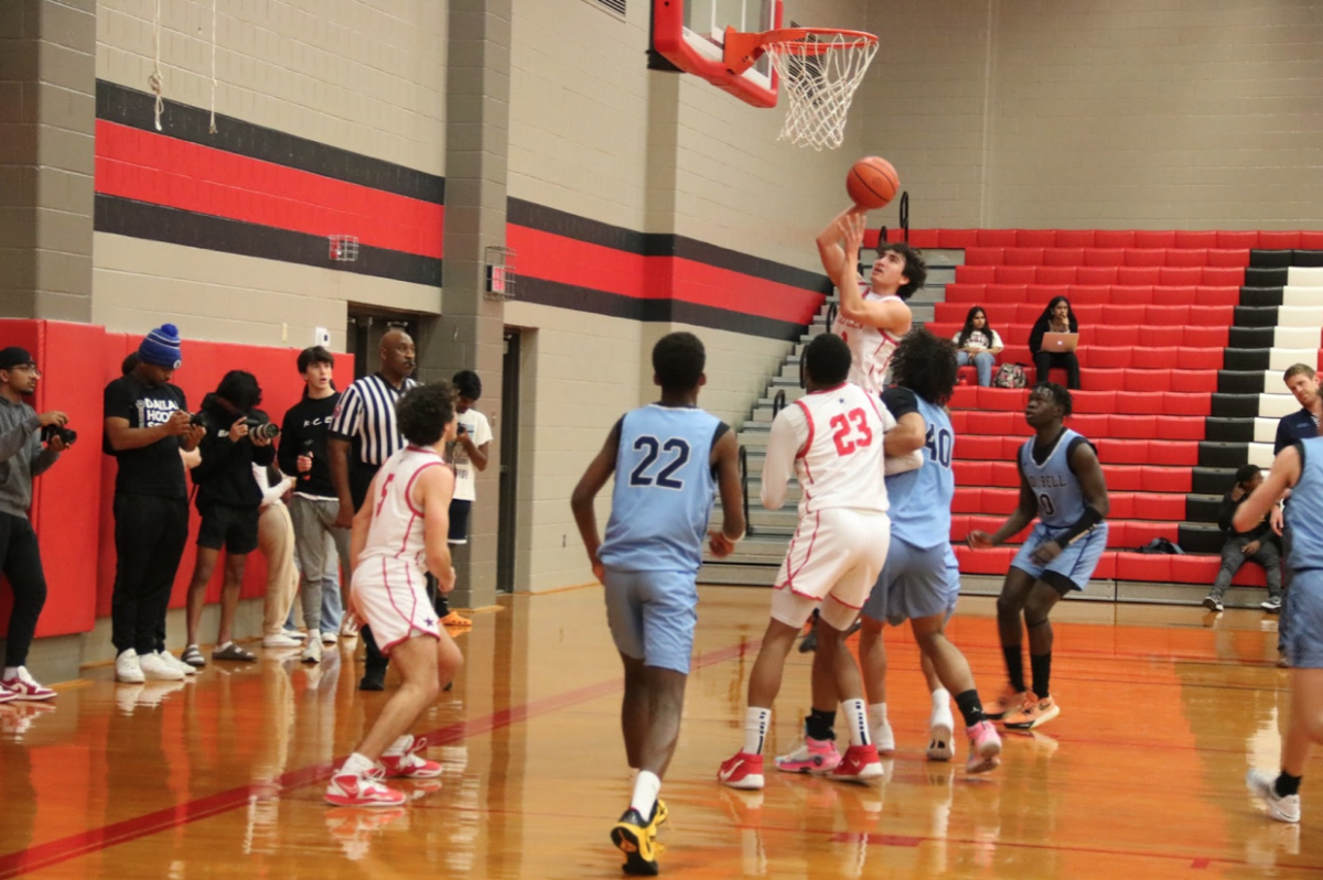 Coppell senior forward Antonio Romo scores a layup against Hurst L.D. Bell on Friday at CHS Large Gym. Coppell defeated L.D. Bell, 62-51.