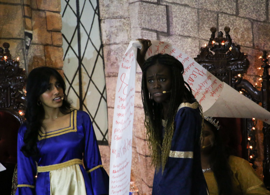 Coppell senior Divya Ghanta and junior Sweetie Ansah act as Sofia and The Minstrel during the Madrigals Feast. Coppell Choir hosted the 29th annual Madrigals Feast at the CHS Commons on Friday and Saturday.

