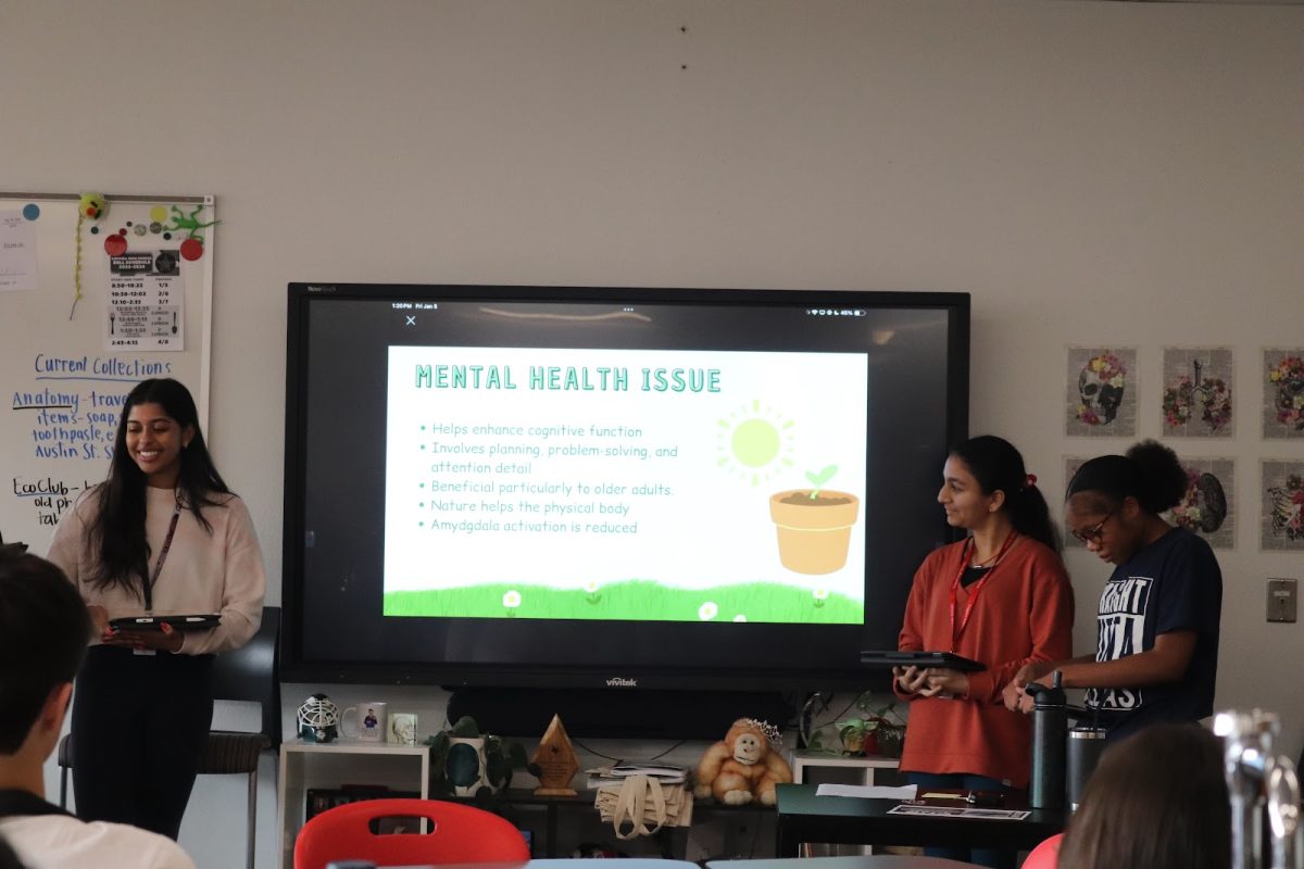 Coppell High School juniors Aishi Biswal, Amrita Vittal and Jada Parker present how interacting with nature eases anxiety. CHS Anatomy & Physiology classes present ideas of booths to target mental health issues.