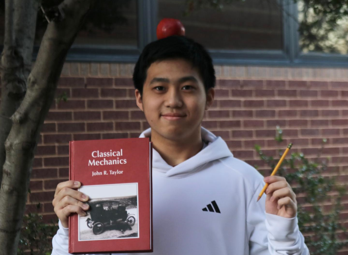 Coppell+High+School+senior+Jerry+Wang+develops+his+passion+for+physics+as+AP+Physics+teacher+Dr.+Robert+Gribble%E2%80%99s+student+aide.+Wang+is+in+the+Physics+Club+and+plans+to+major+in+physics.