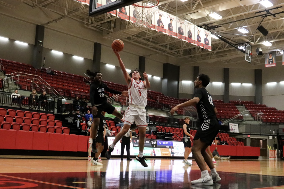 Coppell senior forward Antonio Romo scores a layup against Plano West on Tuesday at CHS Arena. Plano West defeated Coppell, 80-69.
