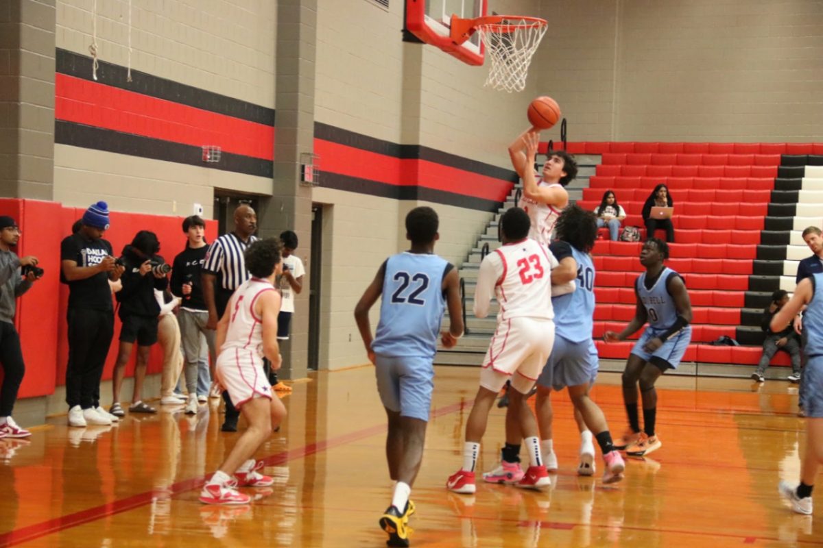 Coppell senior forward Antonio Romo scores a layup against Hurst L.D. Bell on Dec. 1 at CHS Large Gym. Lewisville defeated Coppell in Tuesday’s game, 63-68.
