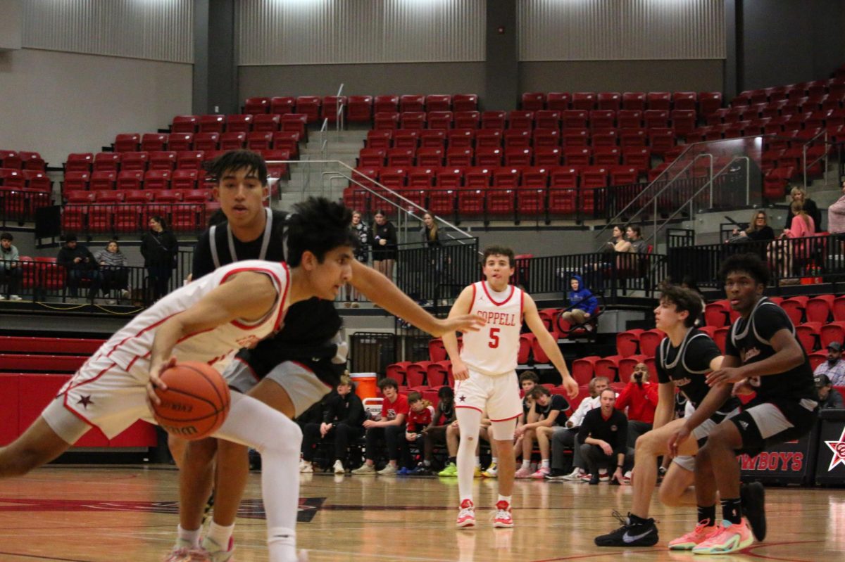 Coppell senior forward Arhan Lapsiwala drives to the hoop on Friday at CHS Arena. Flower Mound Marcus defeated Coppell, 47-37.
