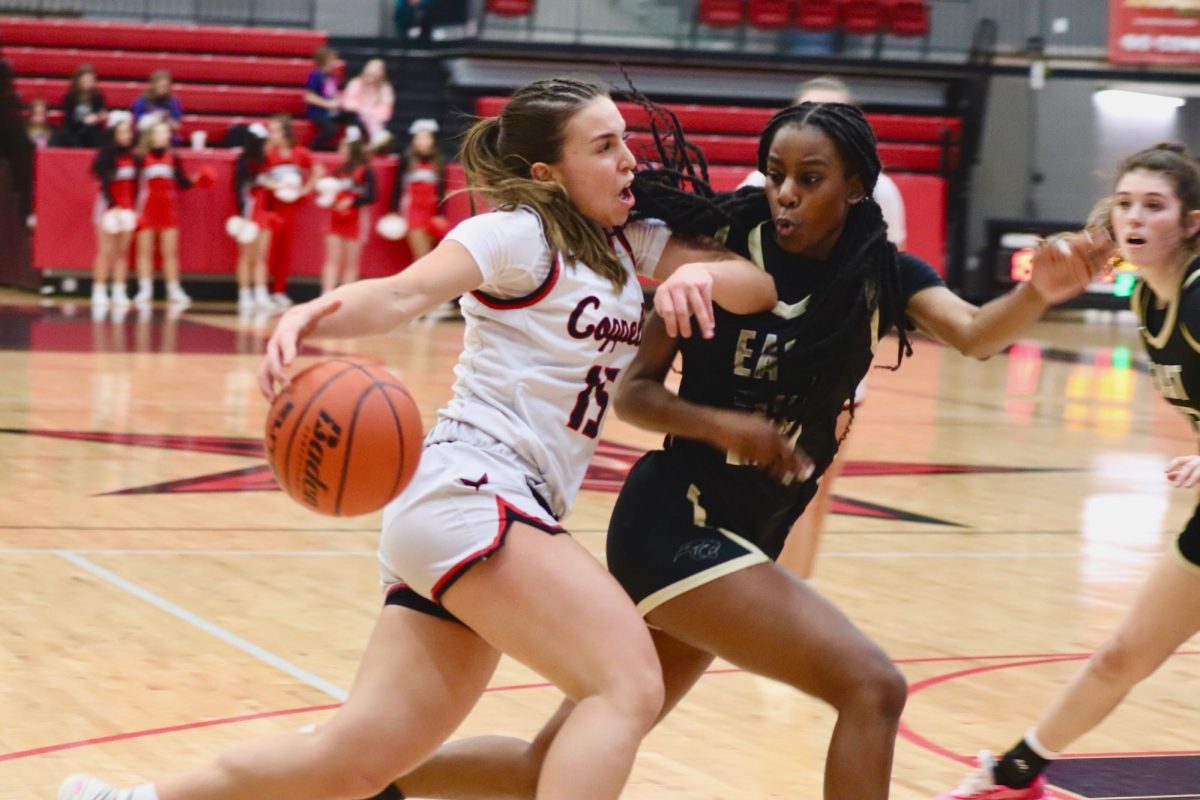 Coppell senior guard Atia Medenica drives against Plano East senior small forward Aniya Smith. Plano East defeated Coppell, 52-45, on Jan. 9 at CHS Arena