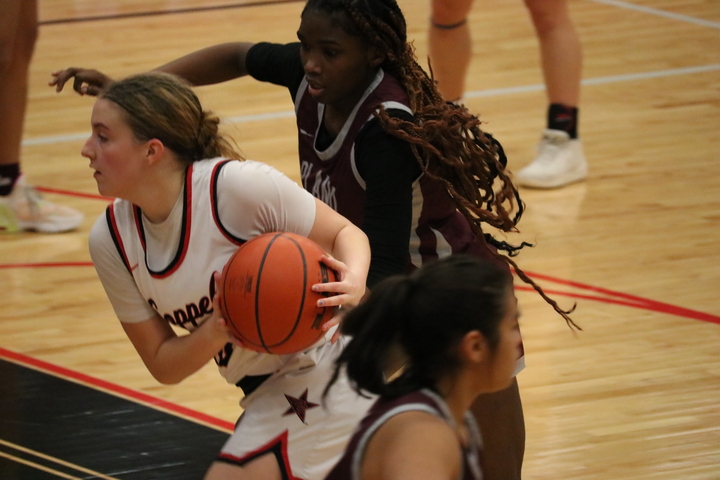Coppell junior guard Landry Sherrer leads the Cowgirls offense against Plano on Friday at CHS Arena. Coppell defeated Plano Senior High, 71-38.