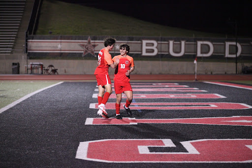 Coppell senior forward Nicholas Eppelman and Luca Grosoli celebrate a goal made against Plano at Buddy Echols Field on Tuesday. The Cowboys defeated the Wildcats, 2-0.

