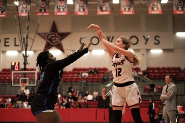 Coppell sophomore guard HC Harding shoots against Hebron junior guard Monet Brown on Jan. 30. The Cowgirls play Allen in the Class 6A Region I bi-district playoffs at Lake Dallas High School on Monday at 6:30 p.m.