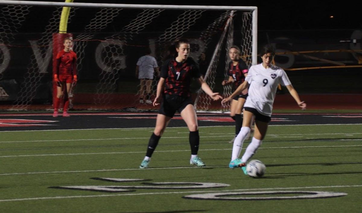 Coppell senior midfielder Ella Spiller defends against Marcus junior forward Maddie Hayes at Buddy Echols Field on Tuesday. The match finished in a 0-0 tie.