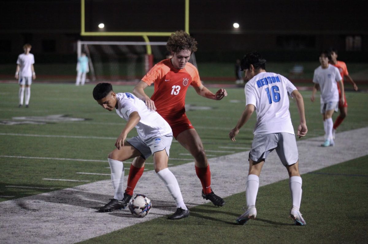 Coppell+junior+forward+J+McGill+breaks+past+Hebron+defense+at+Buddy+Echols+Field+on+Tuesday.+The+Cowboys+beat+the+Hawks%2C+3-0.
