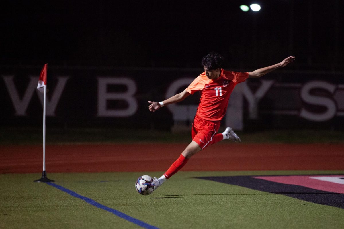 Coppell senior forward Gareth Meza Murillo passes at Buddy Echols Field on Feb. 6. The Cowboys defeated Hebron, who entered the match in first place for District 6-6A, 3-0. 