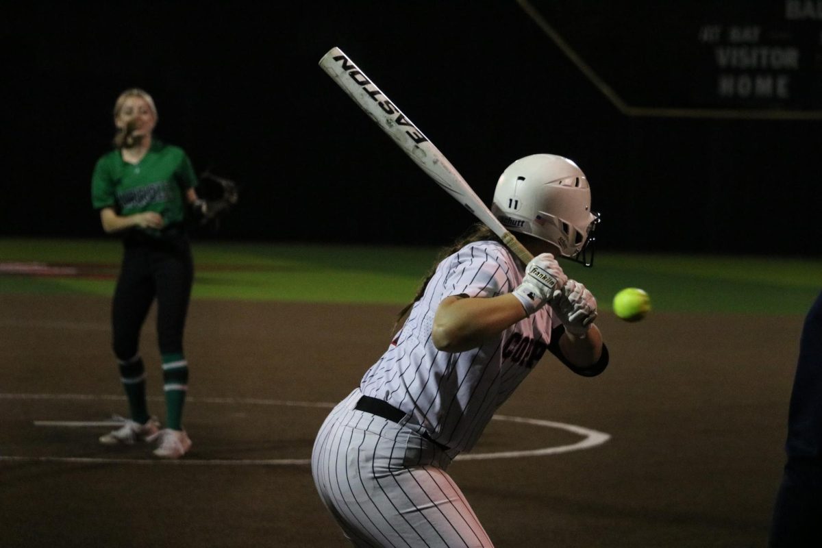 Coppell senior third baseman Mallory Moore bats against Southlake Carroll on Tuesday at the Coppell ISD Baseball/Softball Complex. The Dragons defeated the Cowgirls, 8-4.