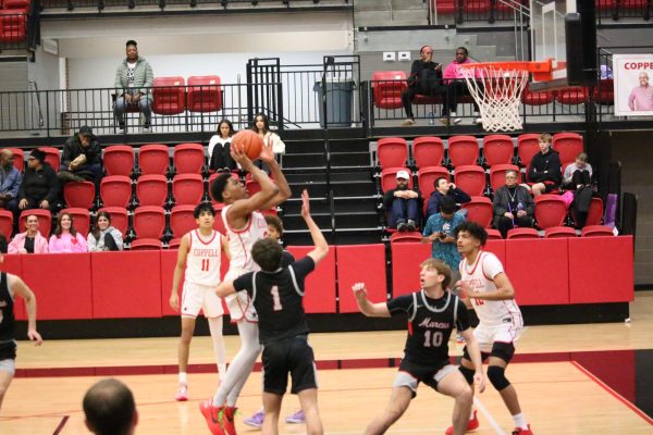 Coppell sophomore forward Sibu Socks shoots against Marcus on Jan. 19 at CHS Arena. The Cowboys play Plano East in their second meeting of the season on Friday at 7 p.m. at CHS Arena. 
