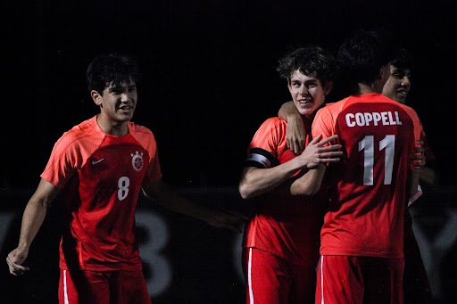 The Coppell boys soccer team celebrates after Coppell senior forward Samuel Stone scores the match’s only goal with 42 seconds left in the first half at Buddy Echols Field on Friday. Coppell hosts Plano East on Friday at 7:30 p.m. at Buddy Echols Field in District 6-6A action. 
