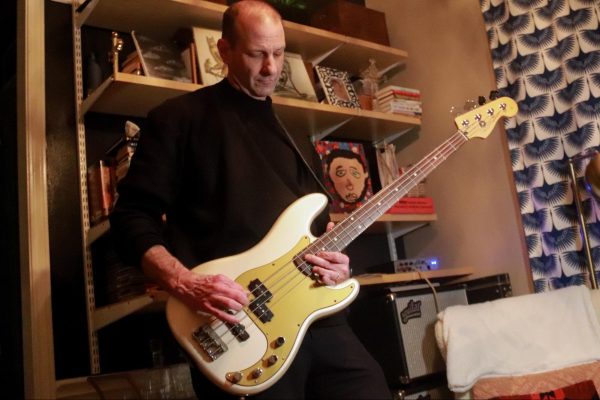 Bart Rogers plays bass to “You Kill Me” by Baboon in his Coppell home office. Rogers has been the bass player for Baboon since 2010, previously playing between 1991-1994. 