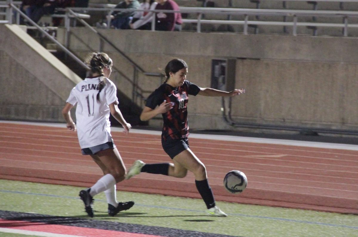 Plano sophomore defender Lainey Przywara defends Coppell sophomore forward Sofia Chavez at Buddy Echols Field on March 19. Coppell travels to Prosper for the Class 6A Region I bi-district playoffs at 6 p.m. tonight.