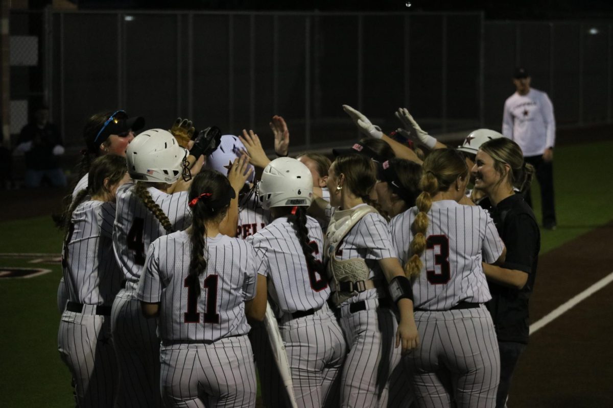 The+Coppell+softball+team+celebrates+a+home+run+scored+by+Coppell+sophomore+right+fielder+Audrey+Pham+during+the+third+inning+against+Flower+Mound+on+Friday+at+the+Coppell+ISD+Baseball%2FSoftball+Complex.+The+Jaguars+defeated+the+Cowgirls%2C+14-1.